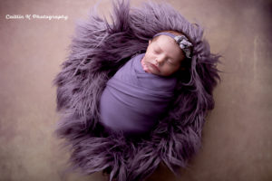 purple newborn portrait
