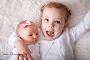 newborn and sibling