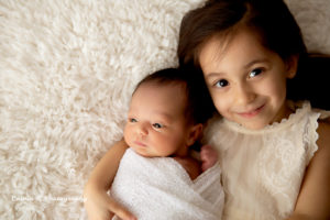 newborn with sibling