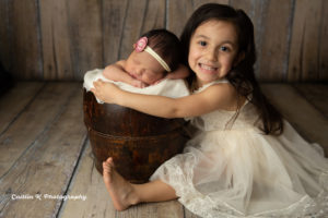 newborn with sibling