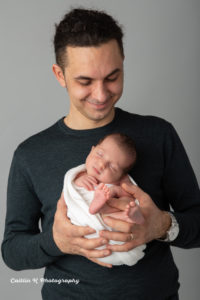 dad and newborn baby