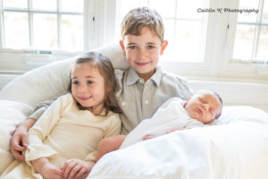 newborn and siblings