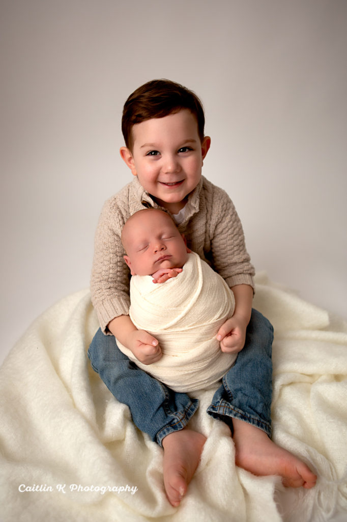 newborn and brother portrait