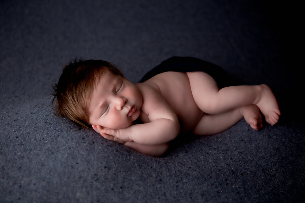 newborn lying on their side