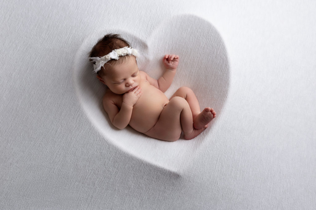 baby in a heart bowl