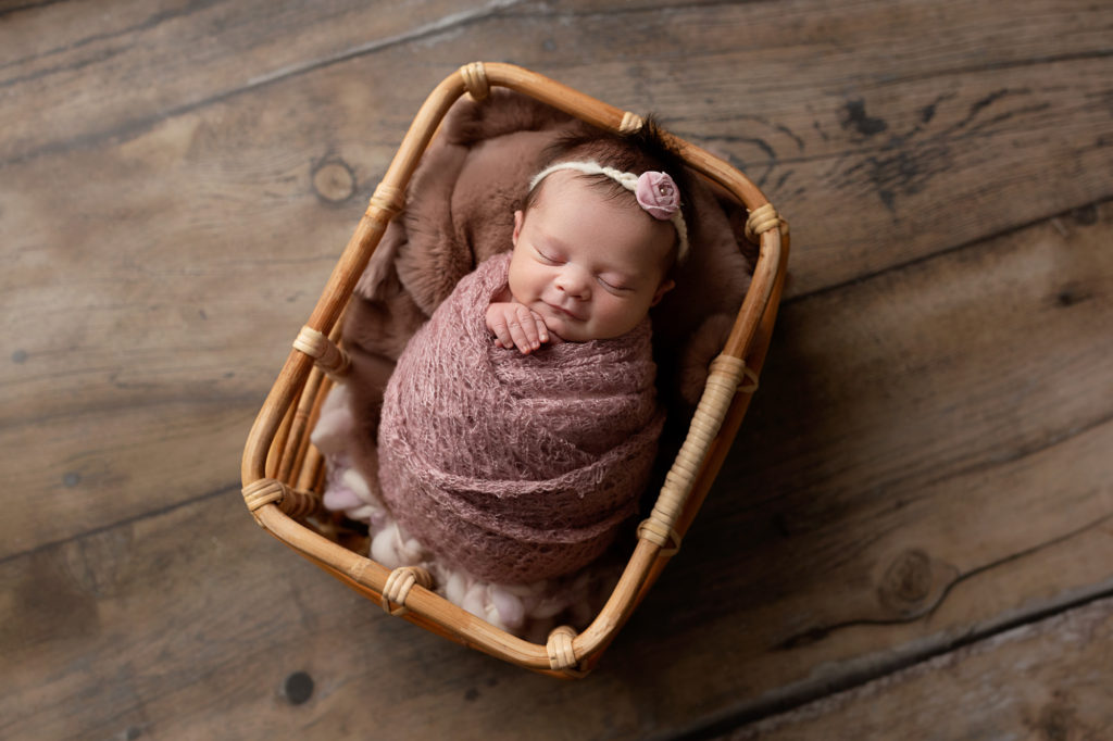 baby in a basket, pulled back