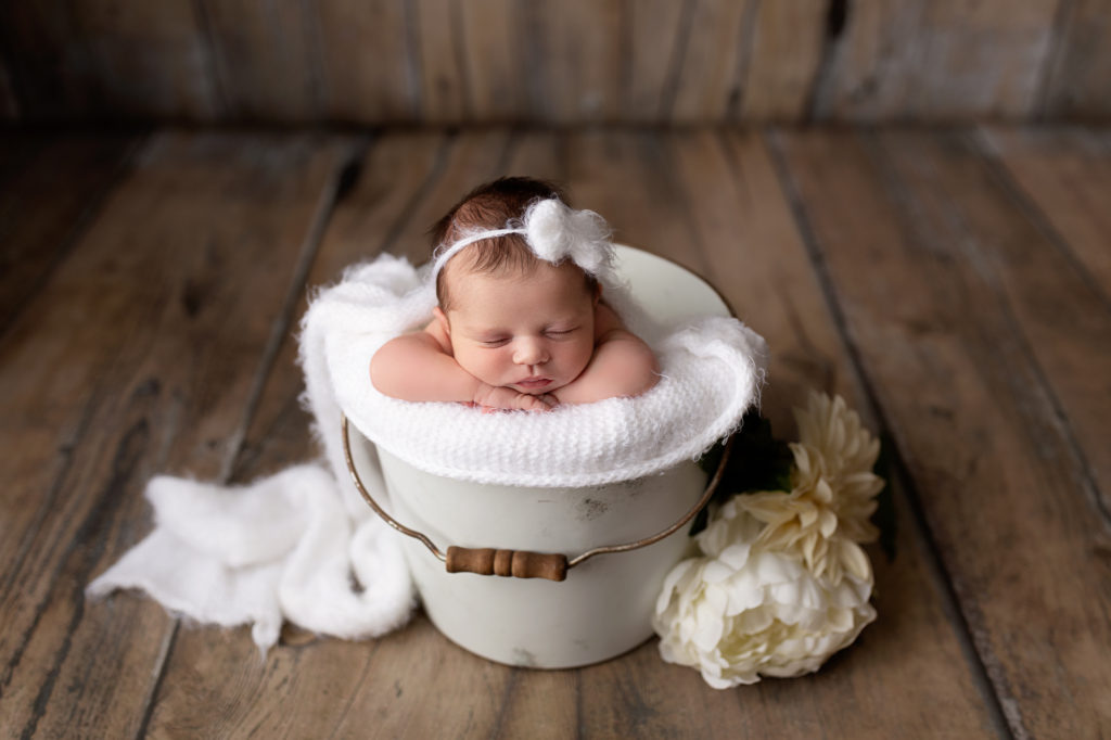 baby girl in a bucket