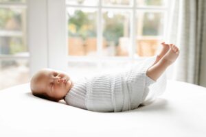 newborn swaddled at home