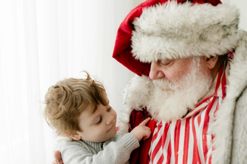 boy pointing to santa's beard