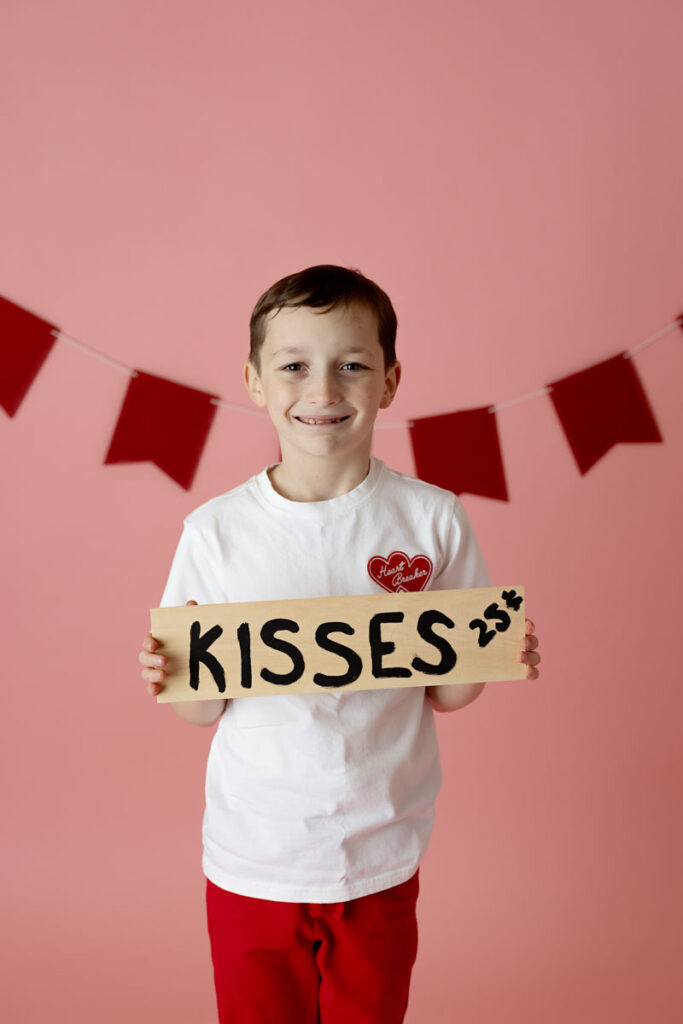 boy holding sign