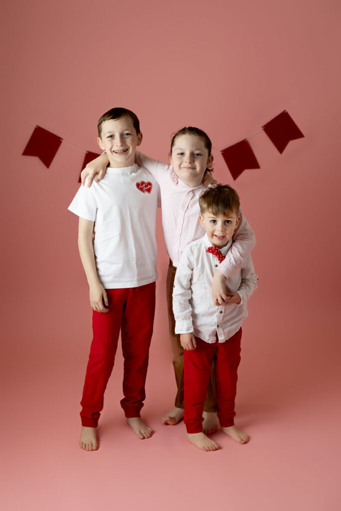 3 brothers on pink backdrop