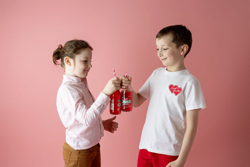 2 boys clinking bottles